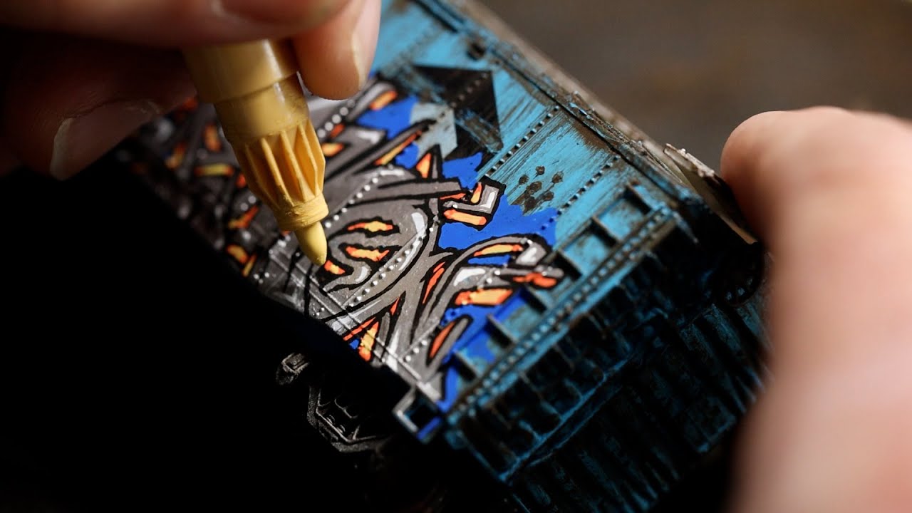 This former 'vandal' ditched the spray cans. Now he paints realistic graffiti on miniature trains