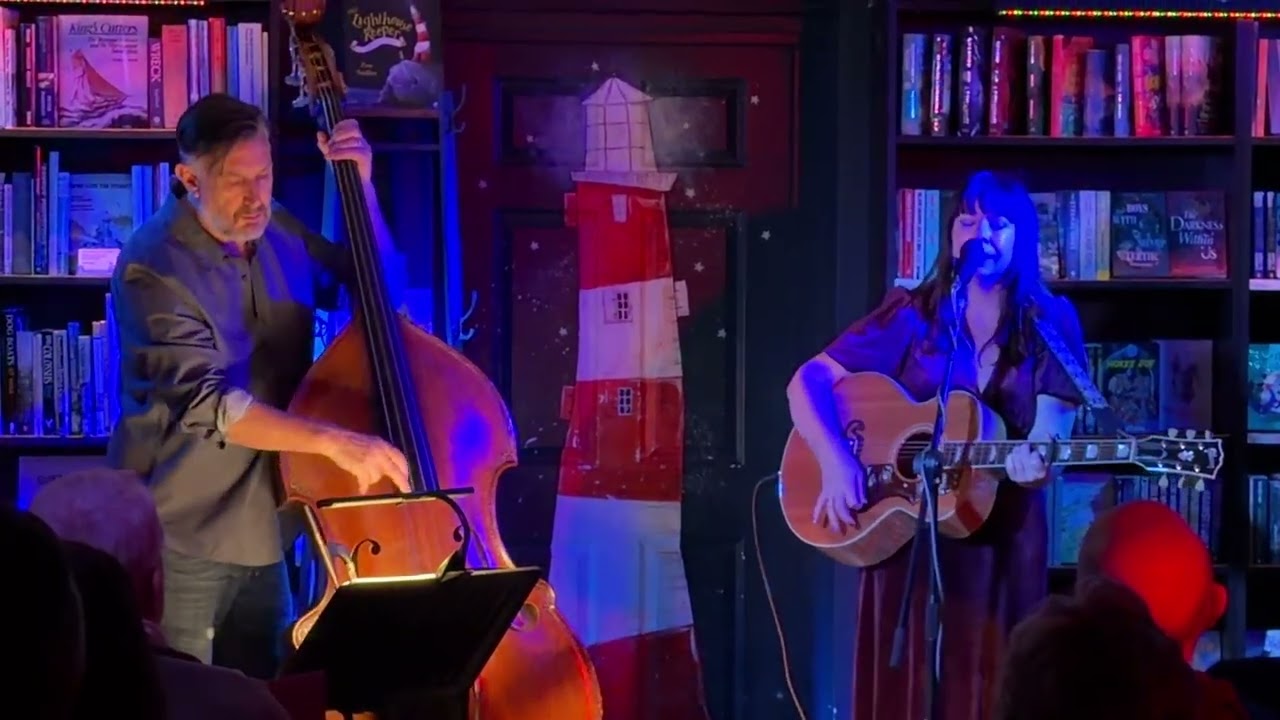 Lucy Kitchen is a British folk singer-songwriter plays at Medina Bookshop. Cowes. Isle of Wight.