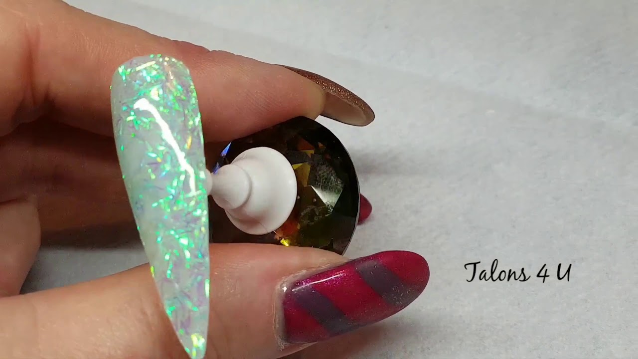 Here are 2 design using Gel Polish ( Natural Glow ) and Aqua Flakes , available at Talons 4 U 💅