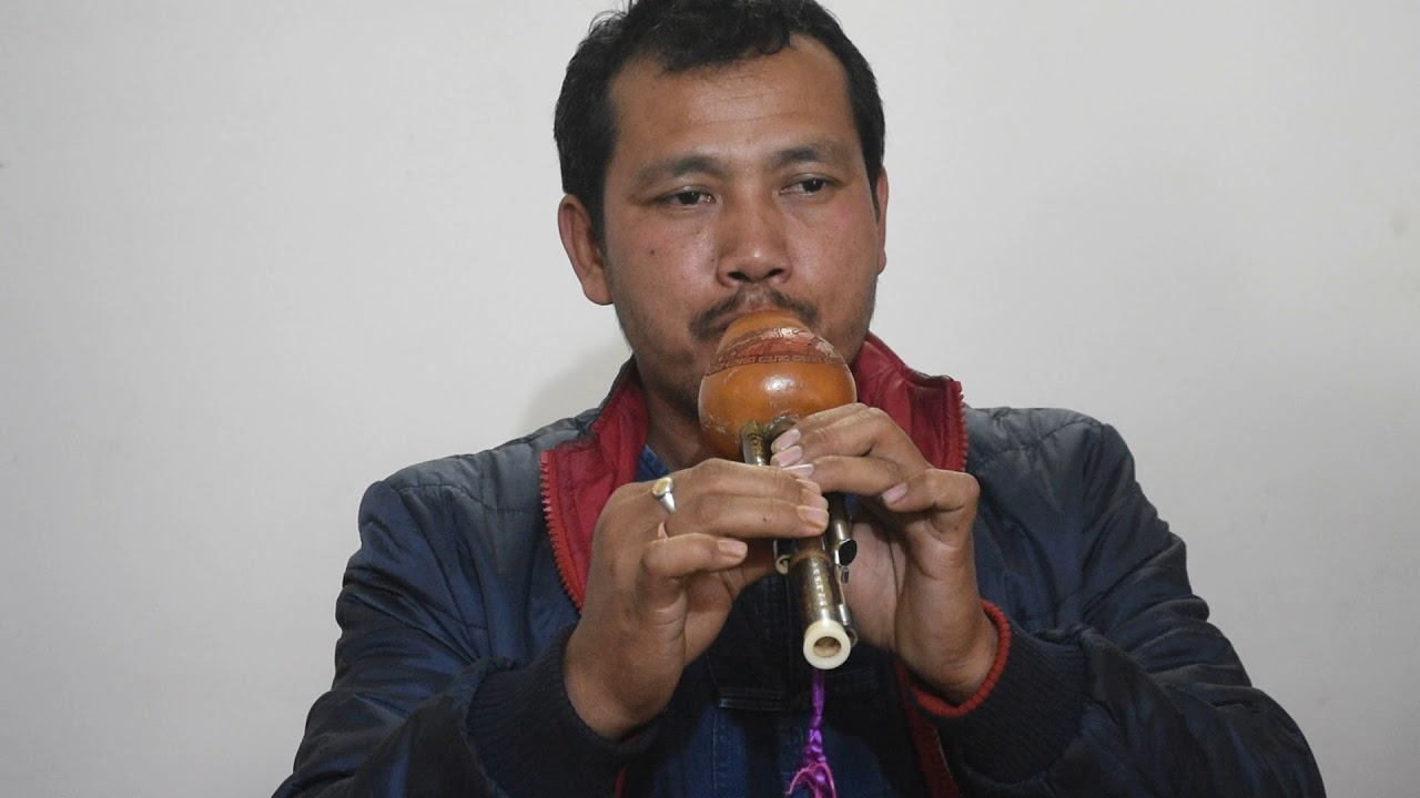 Playing of Pi nam tau (Gourd Flute or Hulusi) by Chao Dulen Phukon