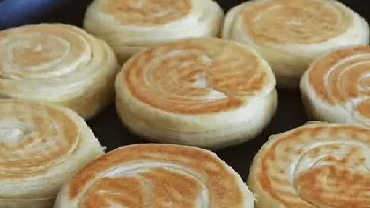 发面饼还能这样做？丝丝缕缕又暄软，做法简单颜值高 #抖音美食推荐官 #面食分享 #新鲜出炉 #千丝饼 发面千丝饼在家也能做，蓬松柔软过程不难，颜值口感都喜欢