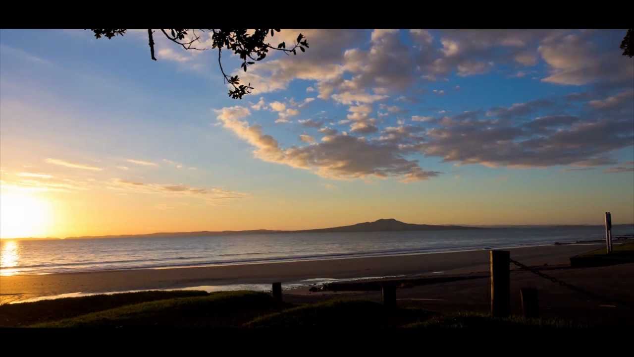 Murrays Bay sunrise and Sunset from East Coast Road.