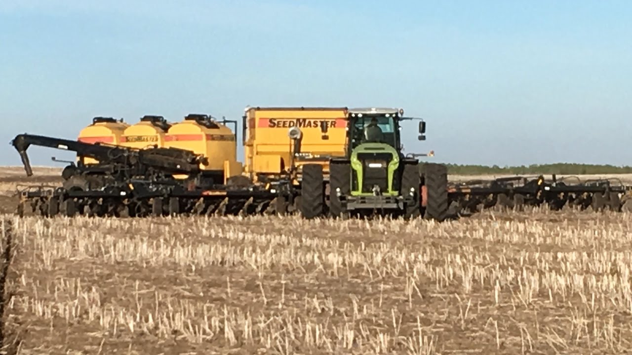 Claas Xerion 5000 pulling big Seedmaster drill