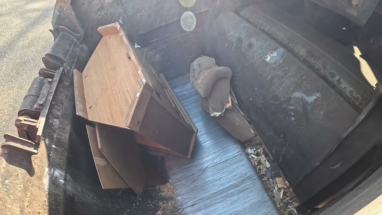 Garbage truck hopper POV: McNeilus RL Crushing bulk trash