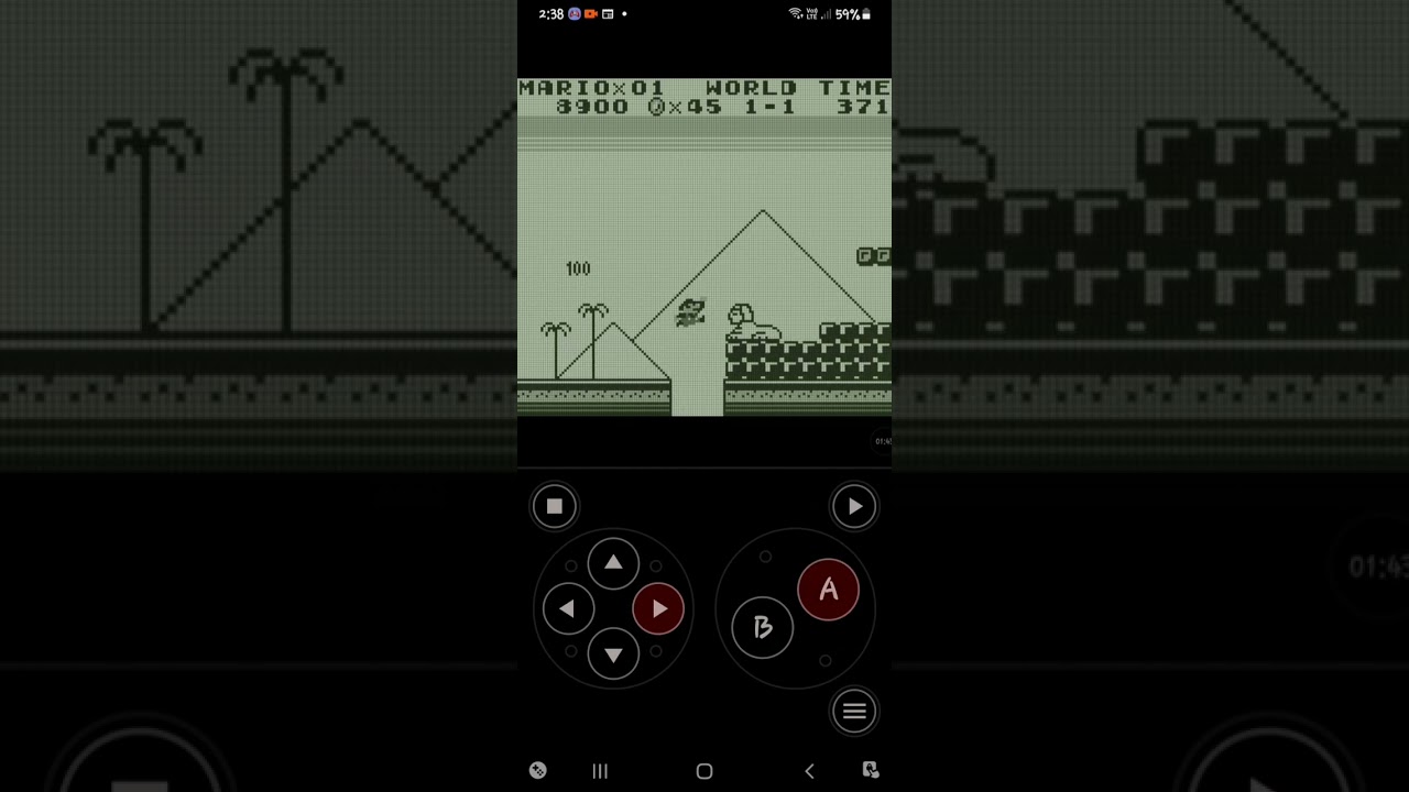 Jugando super mario land mis chavos:)