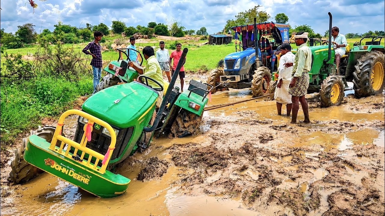 John Deere 5045D tractor stuck in mud ||takes help new holland and John Deere tractors||