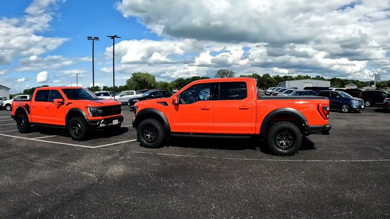 Two Code Orange 2022 Gen 3 Ford F-150 Raptors in the same place: 801A & 800A