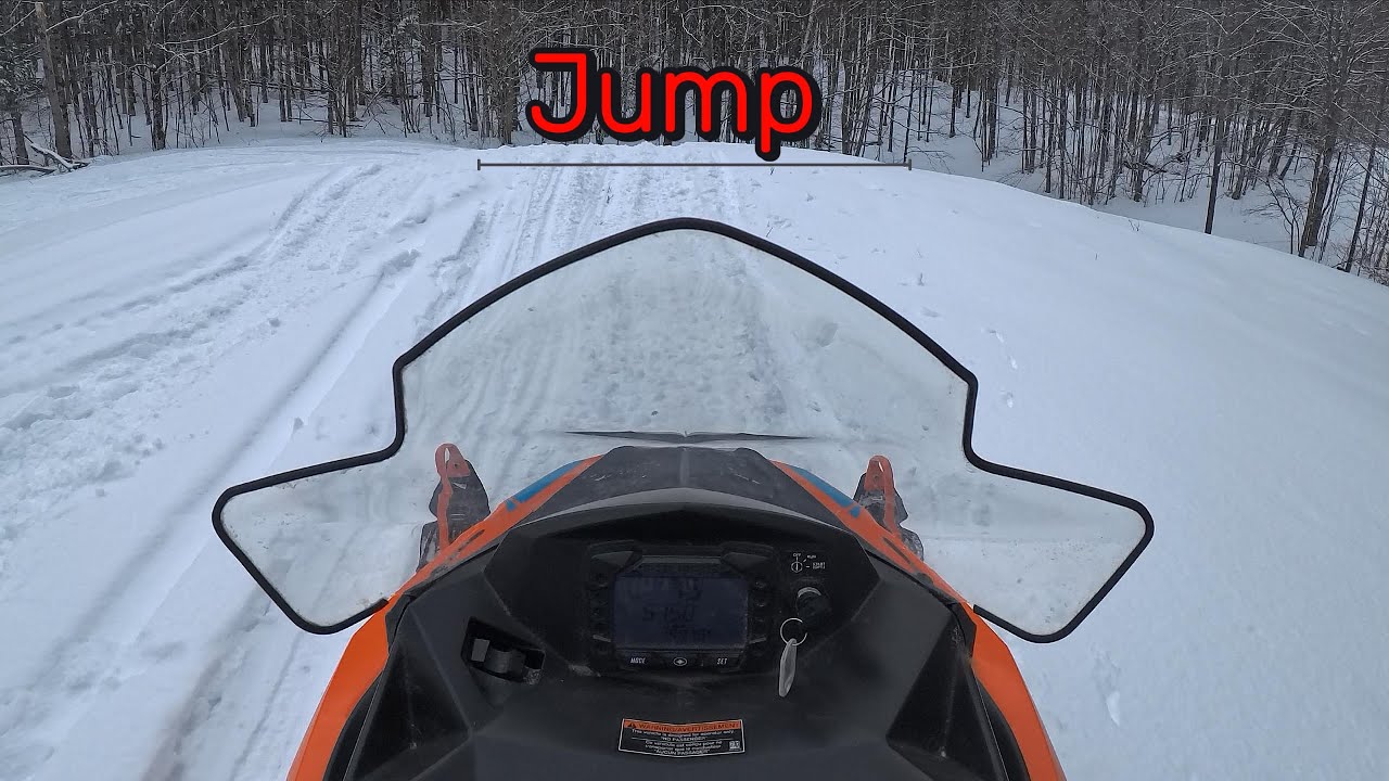 Jumping And Drifting A Snowmobile