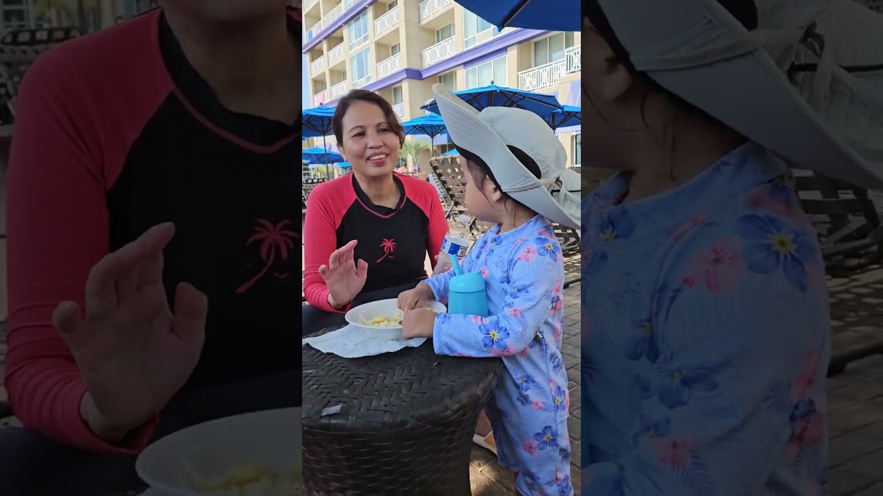 My grandchild Blue is having breakfast at swimming pool VA Beach