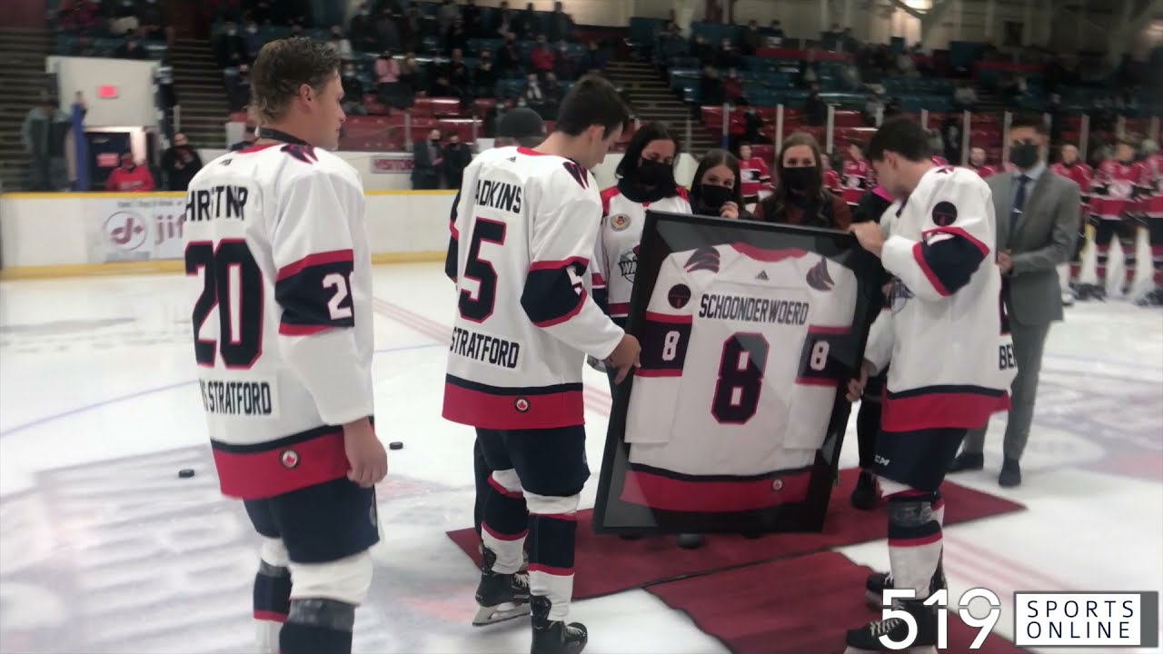 Carter Schoonderwoerd's family presented with a framed jersey by the Stratford Warriors