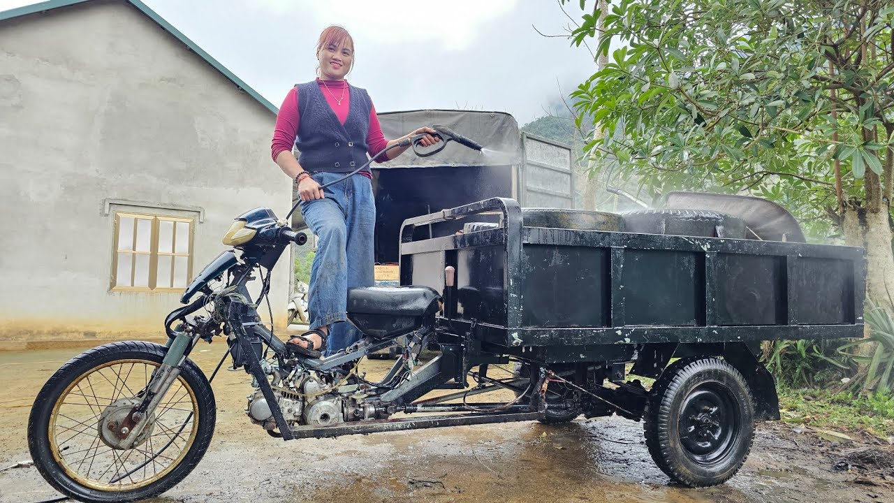 The girl repaired and restored the old tricycle for the neighbor.