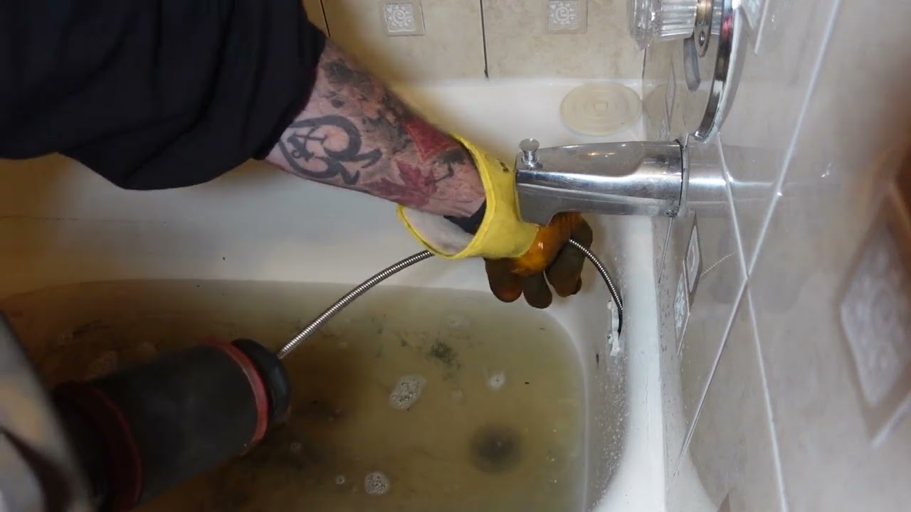 A Bathtub backing Up With Water From The Kitchen Sink.