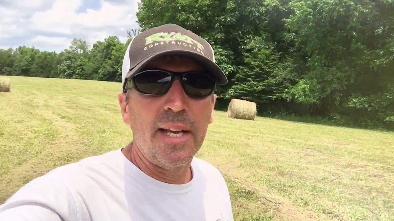 One man moves a 800 POUND HAY BALE!