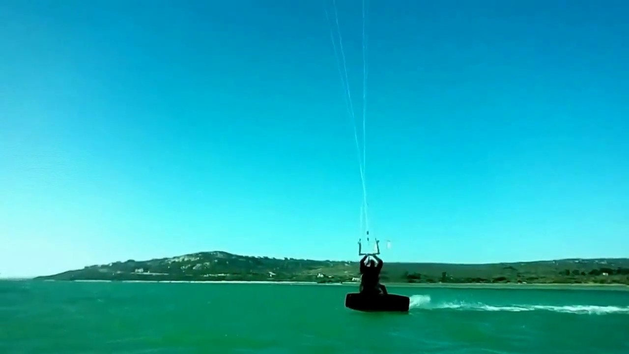 Clare practices a back roll kitesurfing coaching with Tom Fuller