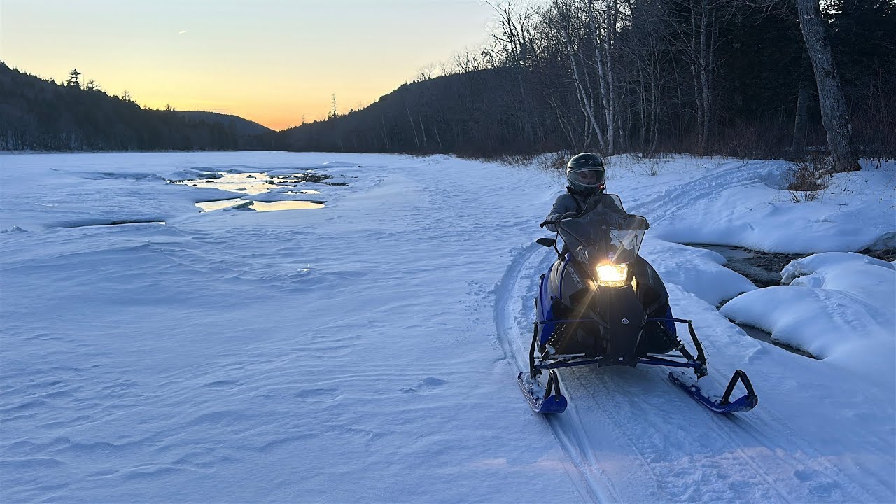 Snowmobiling and exploring unknown roads and trails in the name of adventure.