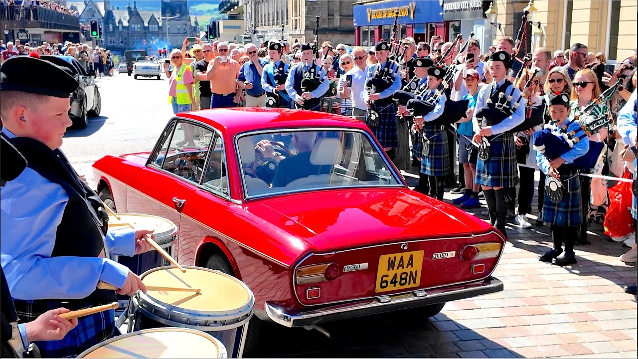 City of Inverness Youth Pipe Band playing as 2025 Classic Vehicle Show parade drives through High St