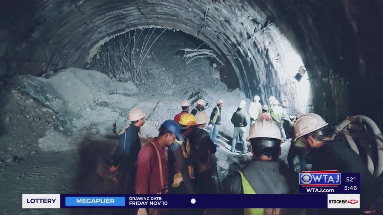 Rescuers dig to reach 40 workers trapped in collapsed road tunnel in north India