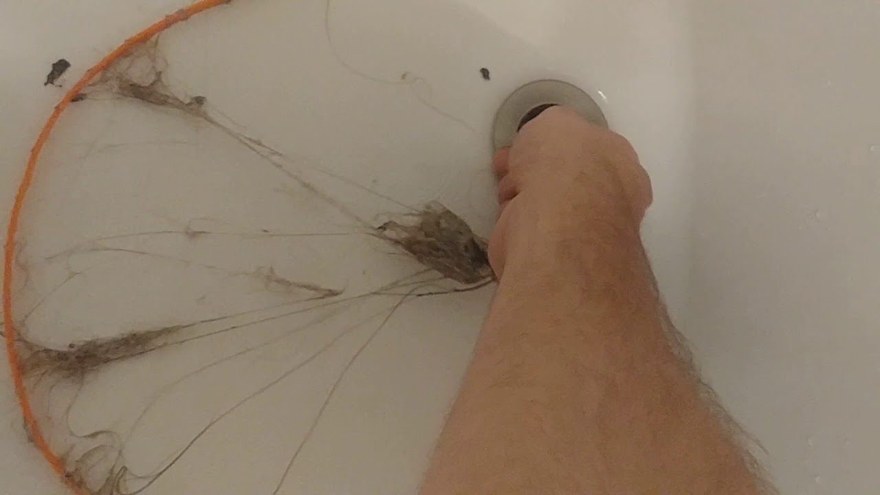 Zip-it type drain cleaner in use