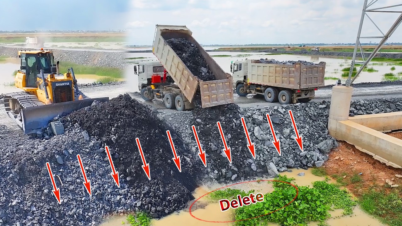 OHh Skillful stone transportation: SHANTUI trucks and dozers are working on the road on the Big Pond