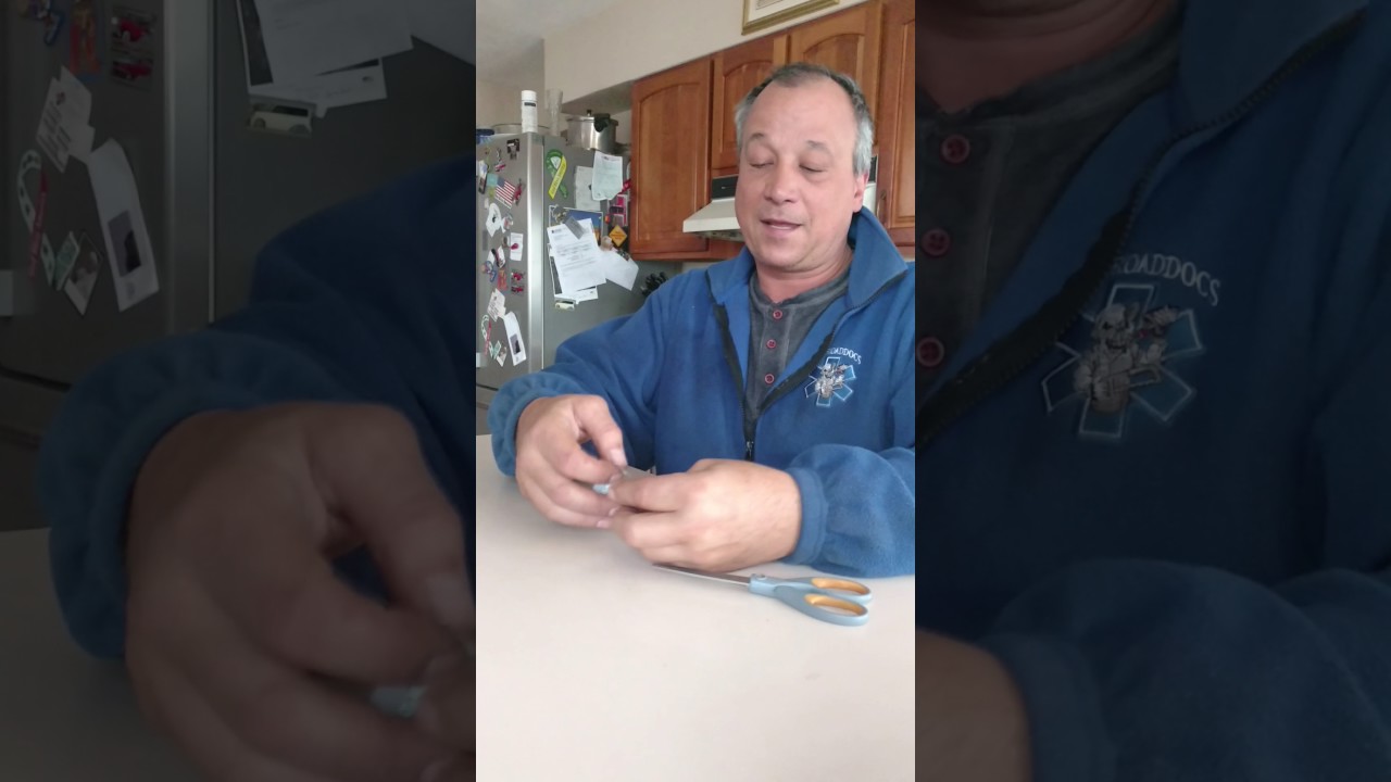 Peeling off the strip off of double sided tape