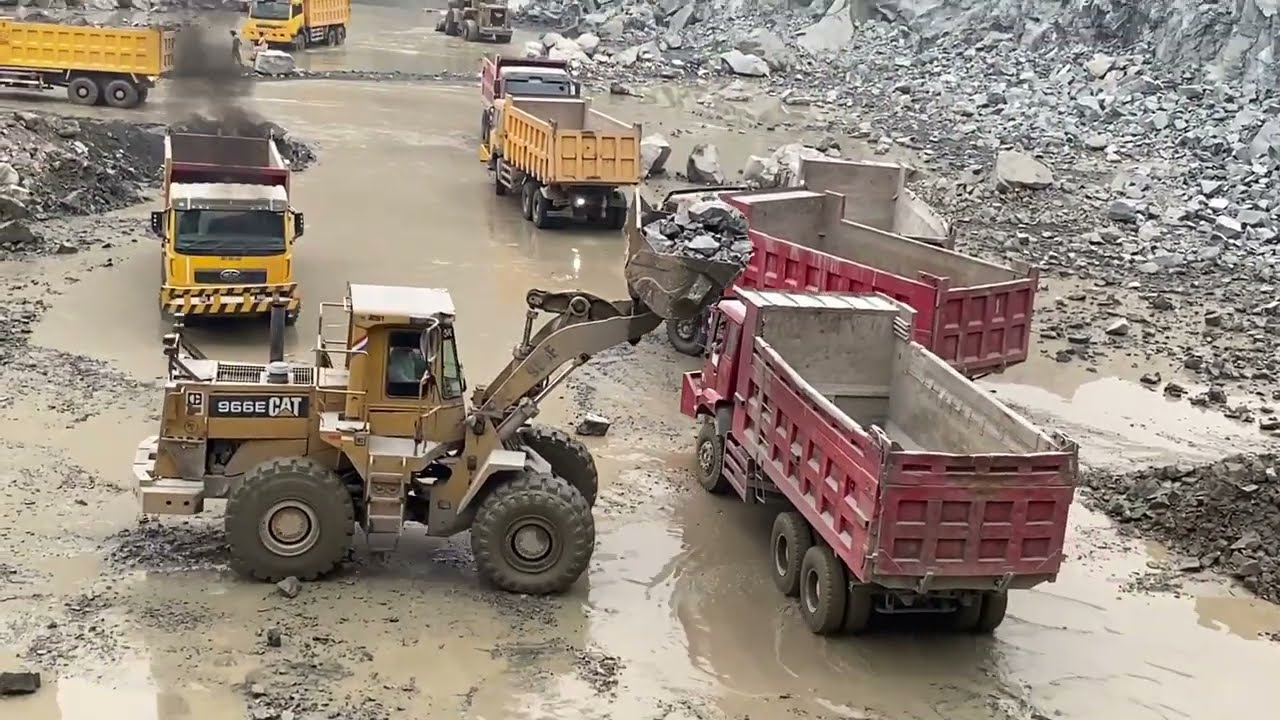 Powerful Caterpillar Filling HOWO Truck with Huge Boulders! 🚜💥