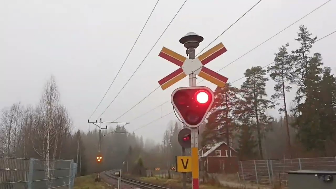 Sweden, Molkom, Skolgatan, Green Cargo freight train passing by Molkom 