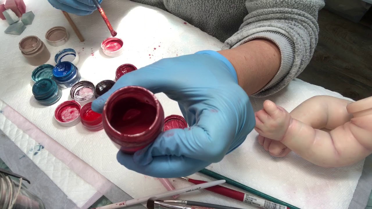 Spring baby painting part 4 mixing up some red paint.