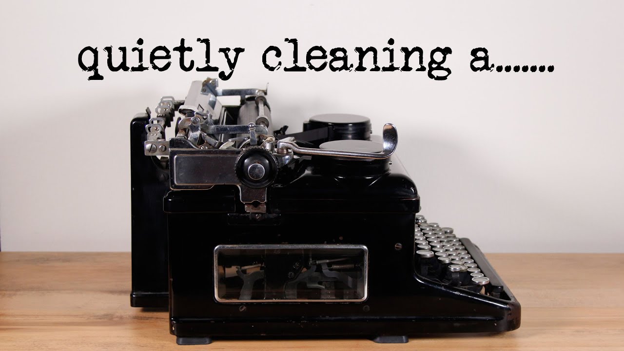quietly cleaning a typewriter