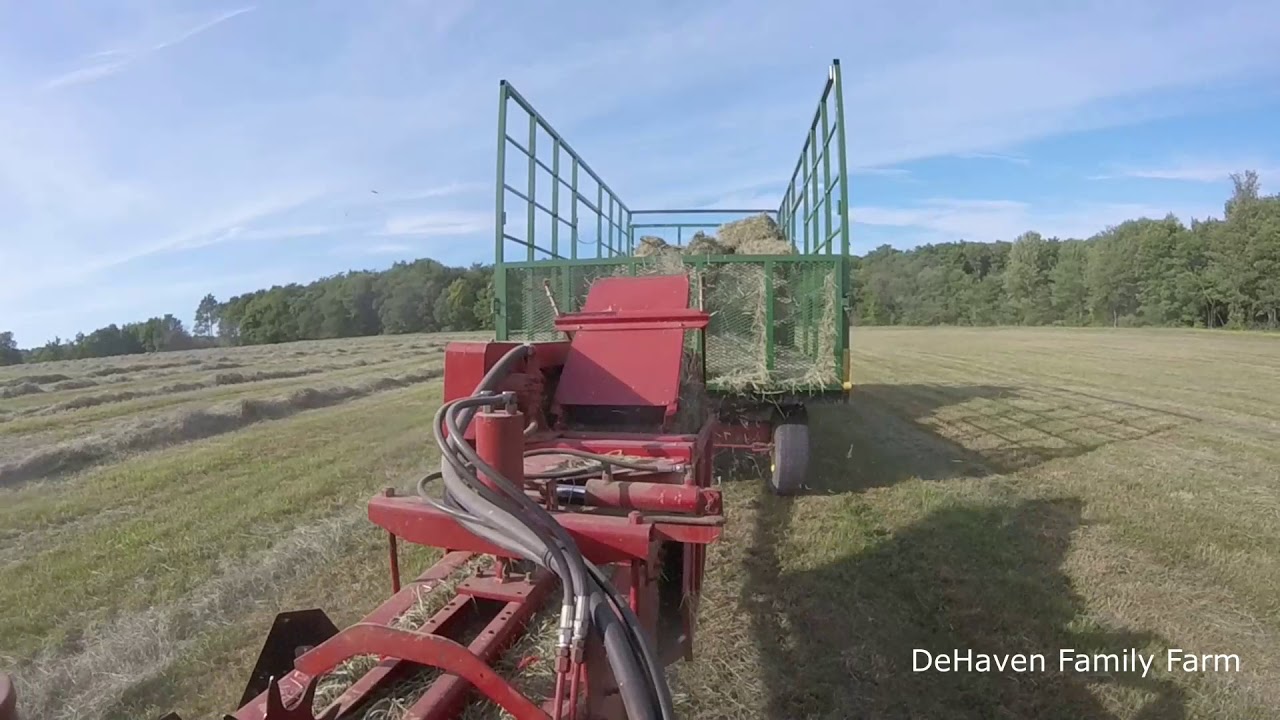 Baling Hay- New Holland 570 pounding out the bales!!!