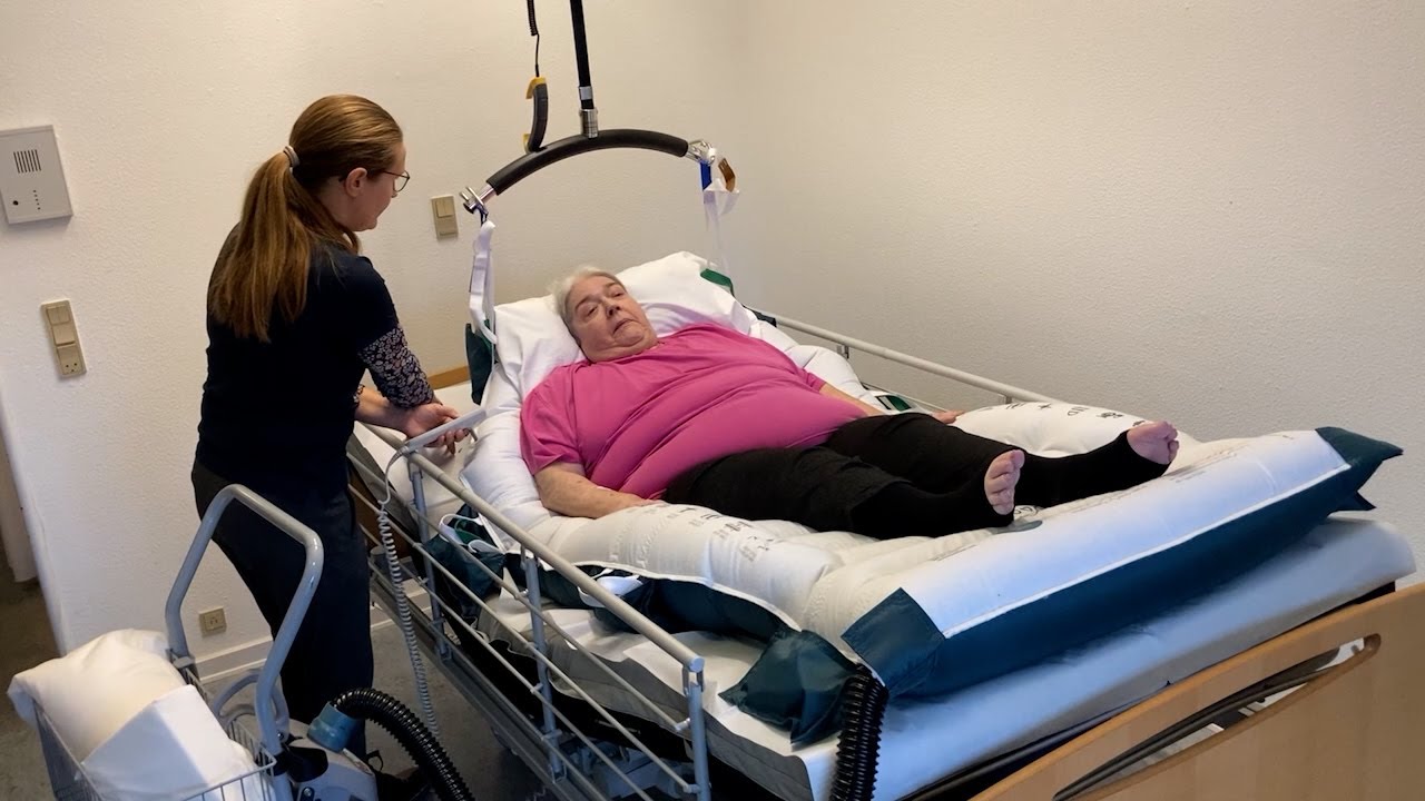 HoverSling Repositioning Sheet - Higher up in bed with one caregiver