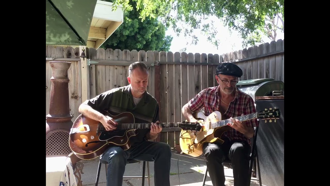 Vince Lee & @TommyHarkenriderguitar  swinging in the backyard