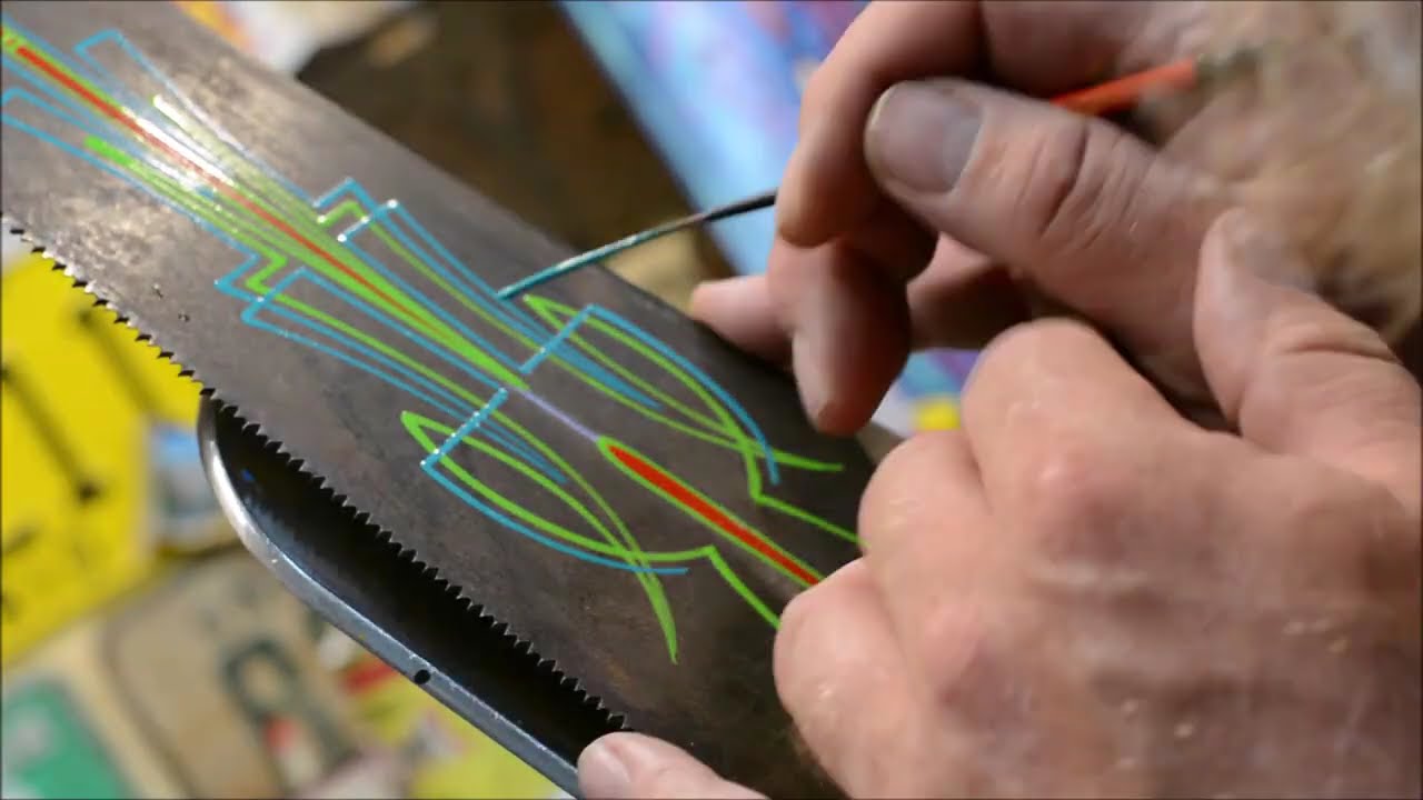 High contrast pinstriping design on an antique hand saw