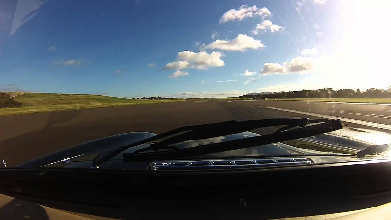 MG RV8 against a TVR Tuscan S3 with Spitfire fly past