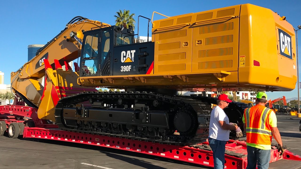 Moving the massive Cat 390F excavator from Conexpo