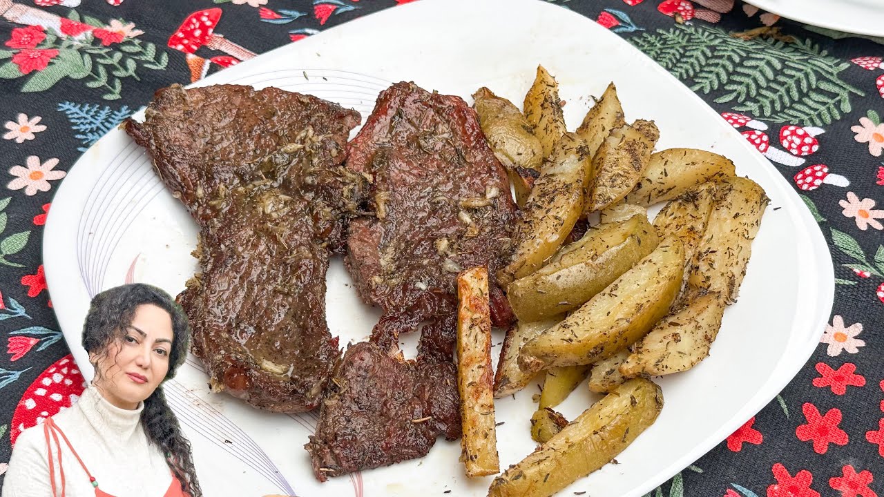 Country life, cooking steak on the fire and potatoes on the fire in the summer air