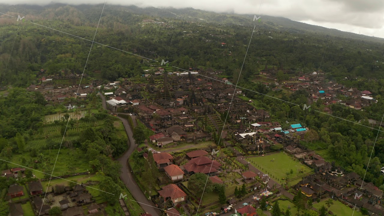 Aerial view of Besakih Temple in Bali, surrounded by rainforest. Wide aerial panoramic view of
