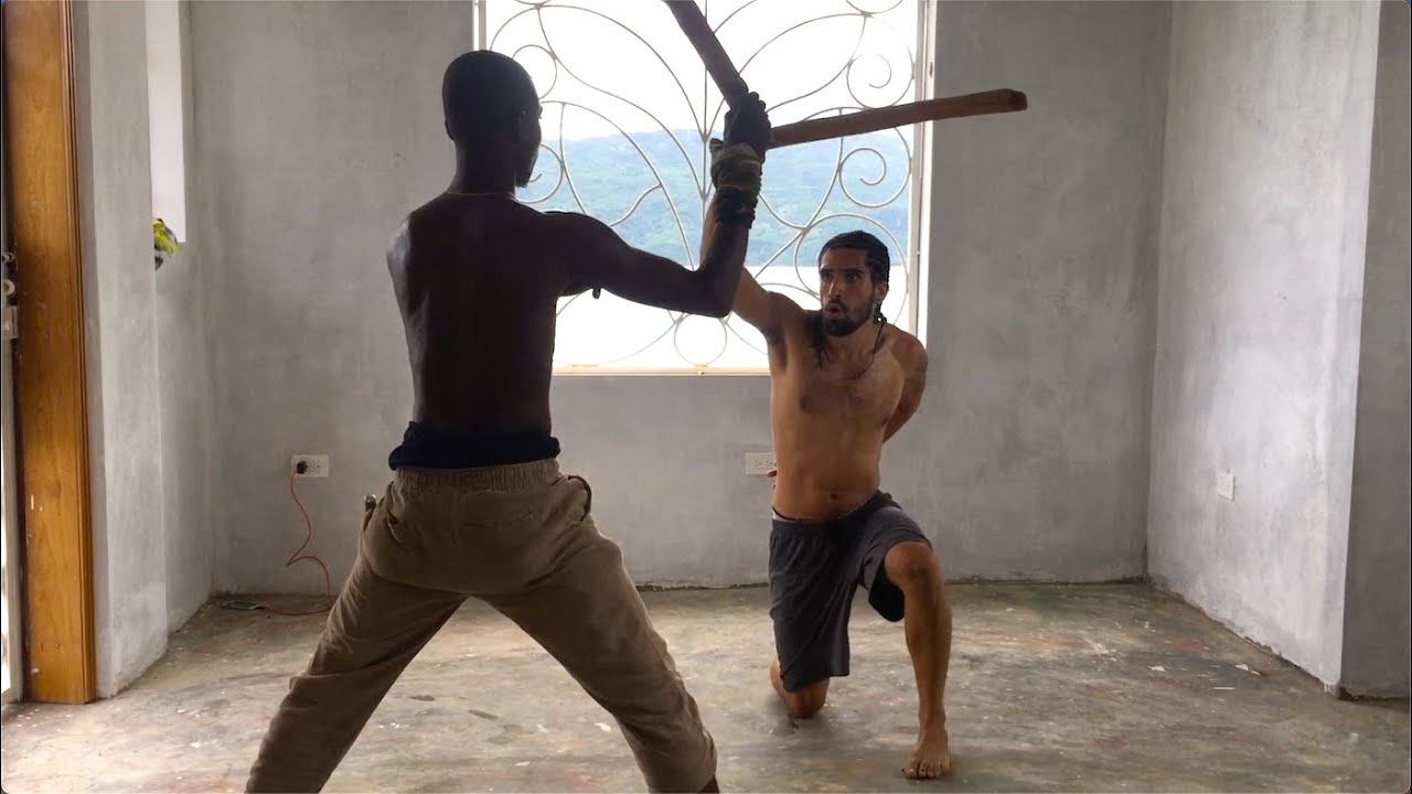 Roland training Lucas with sticks ~ Haitian Machete Fencing  (Summer 2021)