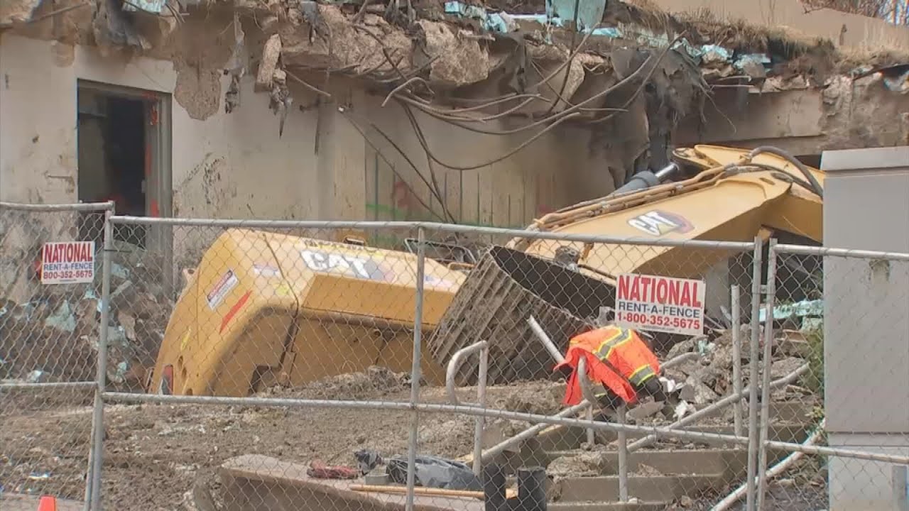Courthouse square demolition halted until toppled over excavator can be removed from ditch