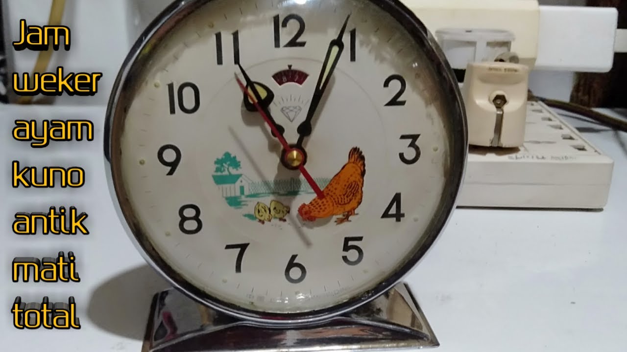 Jam  weker ayam kuno antik di Perbaikin