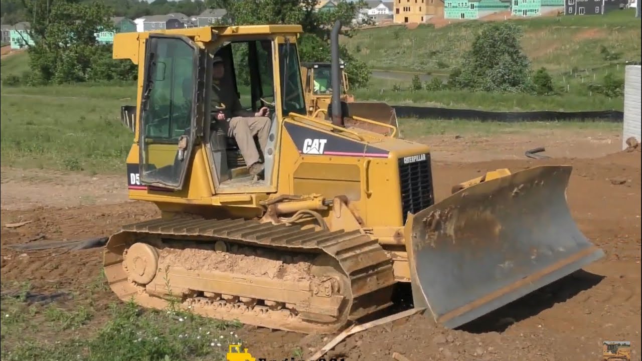 Caterpillar D5G Arrives on Trailer and Begins Backfilling/Grading