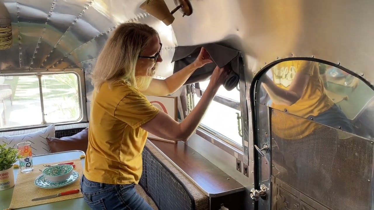 How To Fold the Dani Designs Co Curtain in the 1950 Airstream Cruiser Showing Knobs Behind Curtain