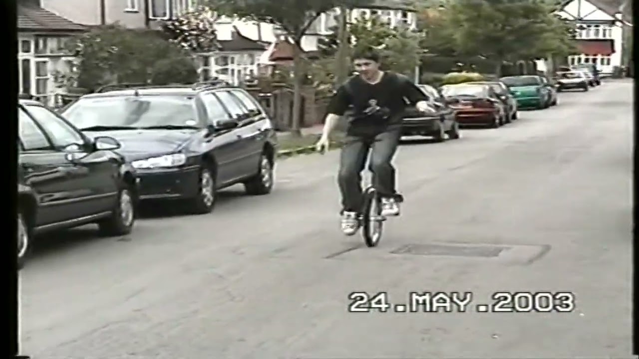 Simon trials bike and unicycling in 2003.