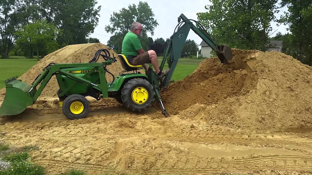 John Deere 317 with Brantly Manufacturing Implements