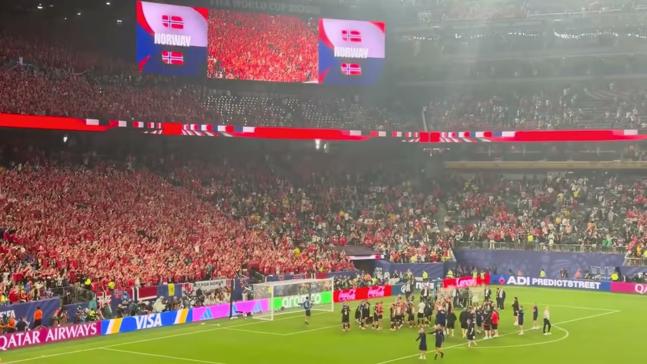 Norway fans and players doing the Viking row after qualifying for the Round of 32.