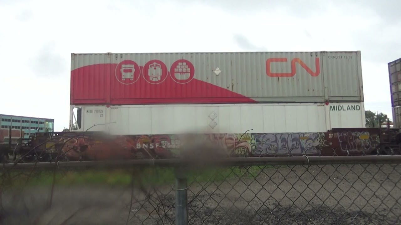 CN 121 intermodal stack train meets 2 GO Transit trains at Pickering station.