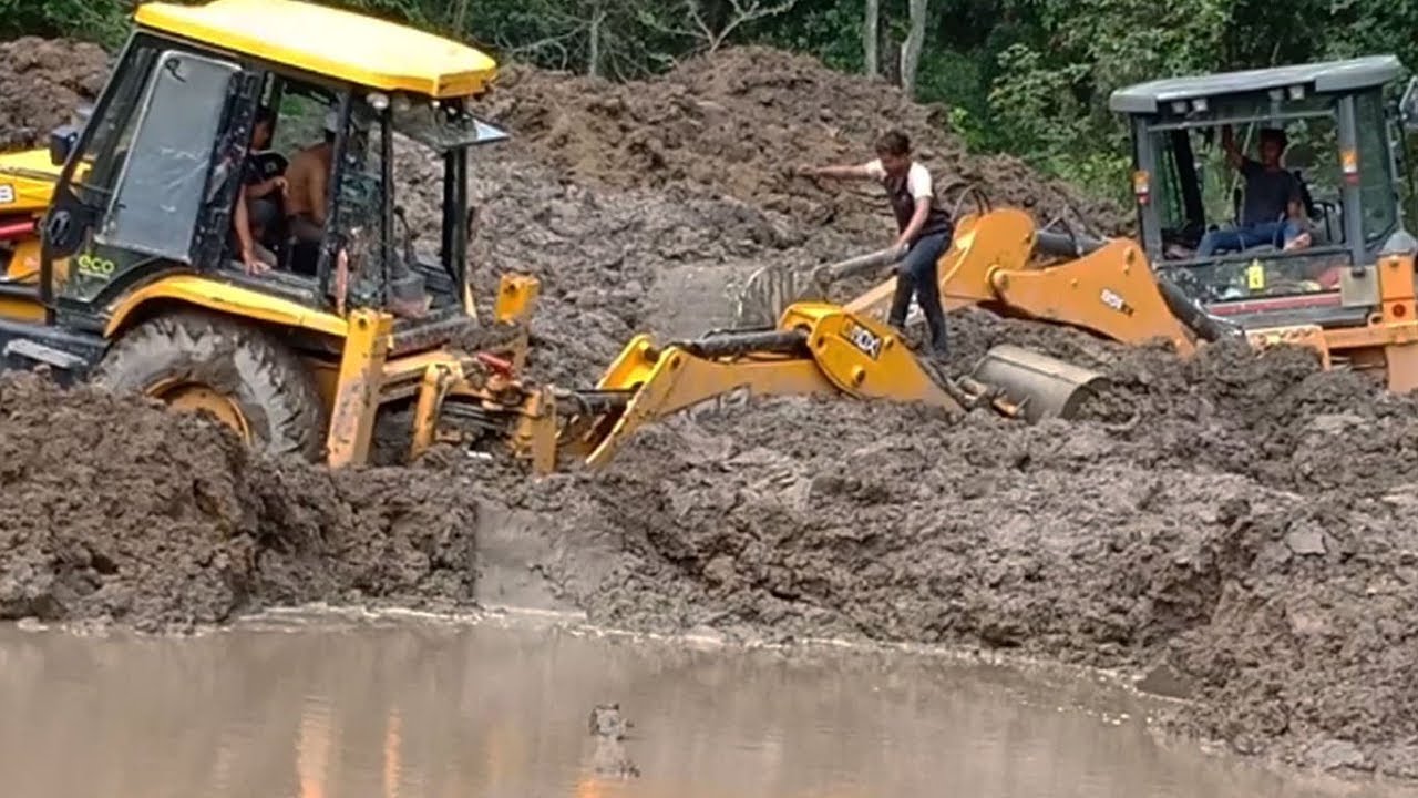 JCB Backhoe-Functions a Bridge Work in Swampy Mud Work