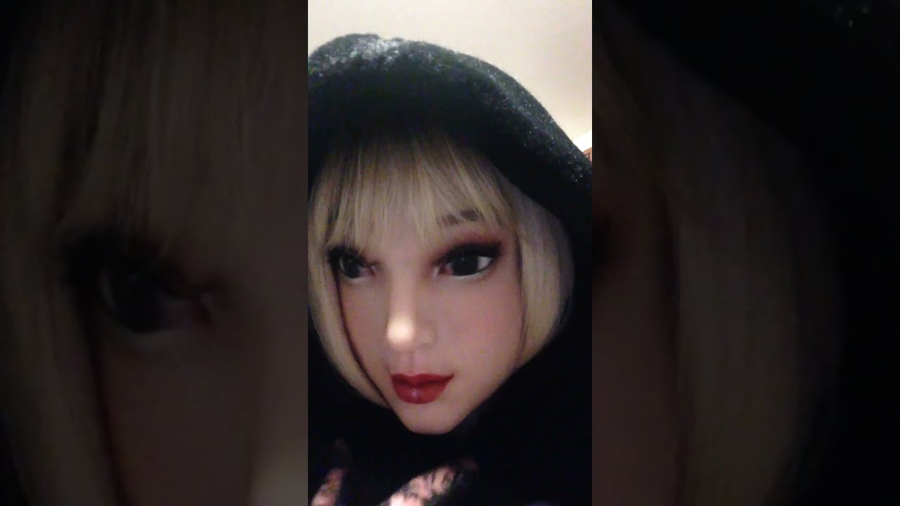 Leather thigh boots in hotel room with doll face female silicone mask (Part 1).