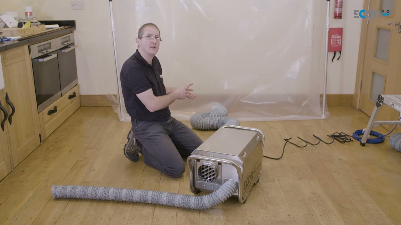 Desiccant dehumidifier placed outside drying tent [DH3500 setup for pressure positive drying]