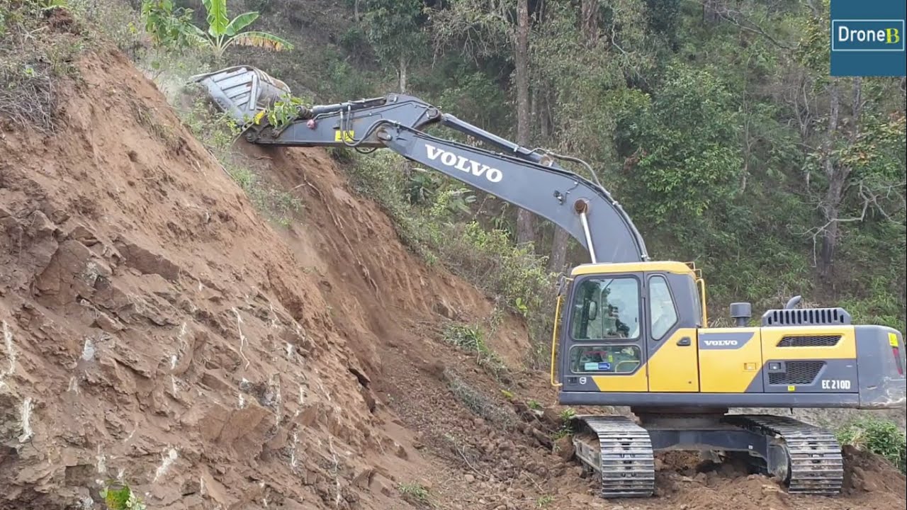 Hilly Road-Volvo Excavator-Back Cutting to Widen the Road