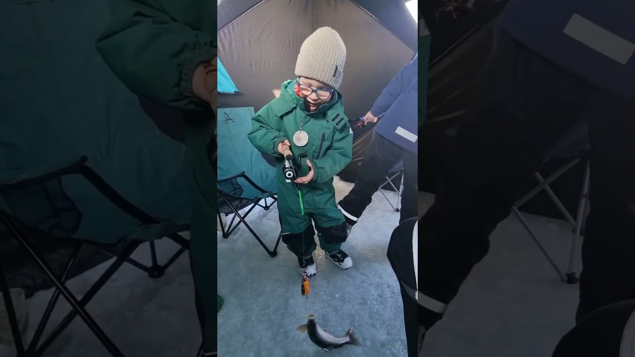 Ice fishing with family and friends at lake Hafravatn, Iceland.